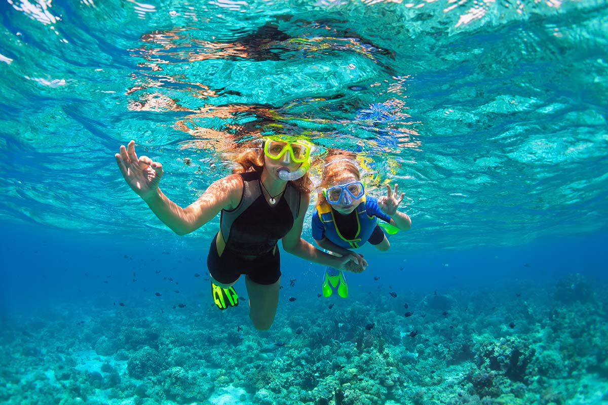 Mom and daughter snorkeling