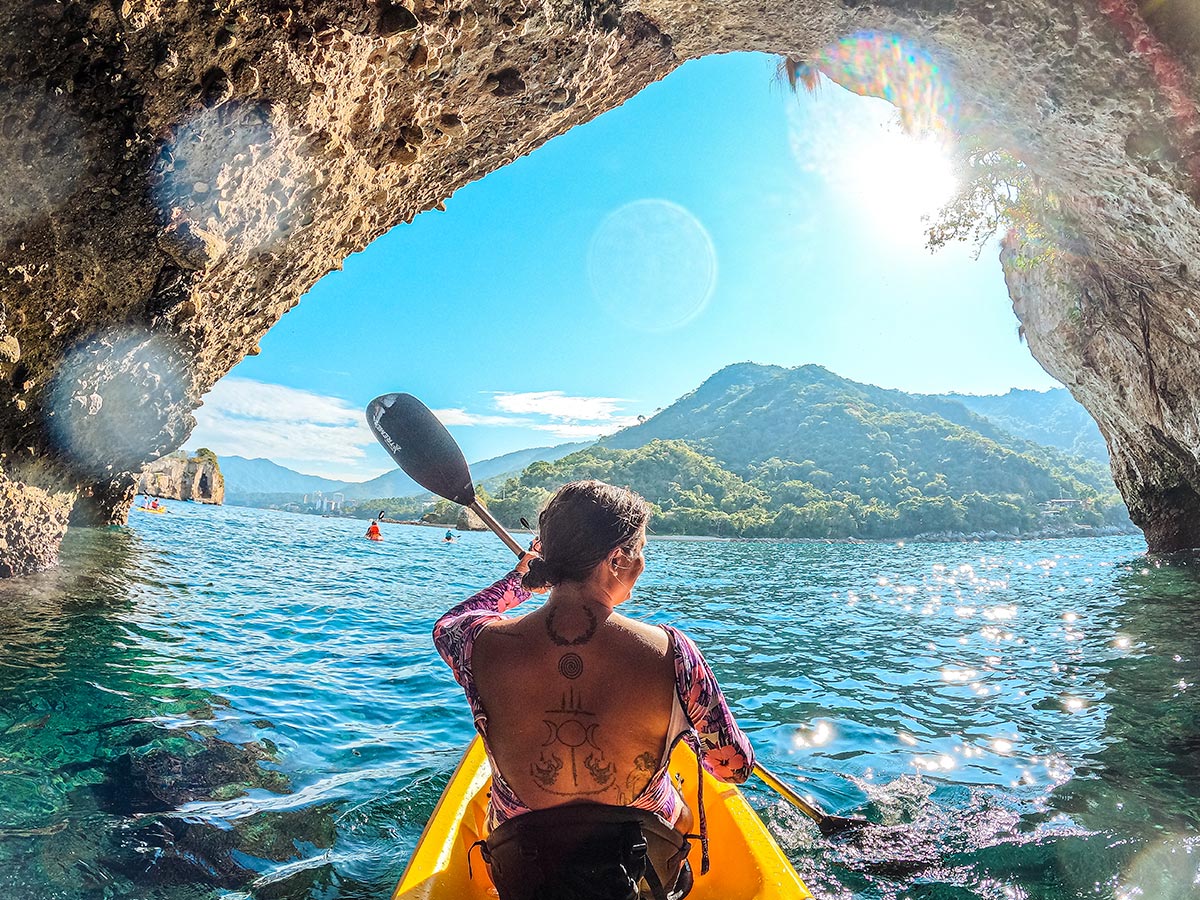 Woman kayaking in Puerto Vallarta's Arches